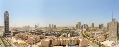 an aerial view of a city with tall buildings at Experience Serenity at Binghatti Crest in JVC in Dubai