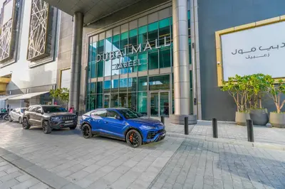 a blue car parked in front of a building at Downtown Luxury, Direct Access to The Dubai Mall in Dubai