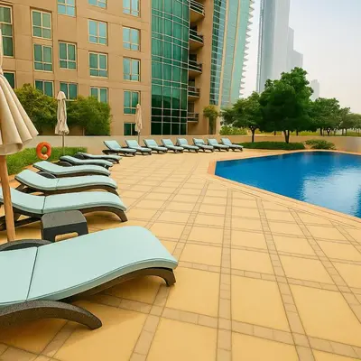 a pool in a hotel with lounge chairs and a building at The residences 1 - Luxury 1BR apt in Downtown Dubai - 2 mins walk to Burj Khalifa & Dubai Mall in Dubai