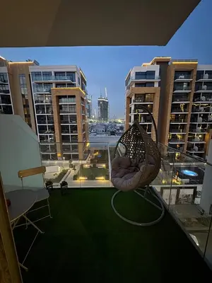 a hammock on a balcony of a building at Chic apartment, Maydan Riviera Dubaï in Dubai