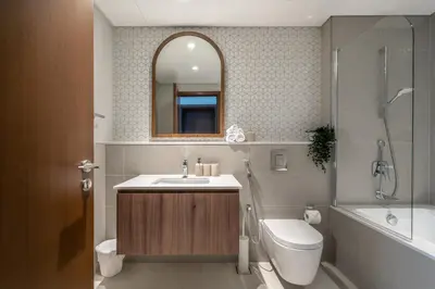 a bathroom with a sink and a toilet and a shower at Vida Voyage - Vida Residences - Creek Harbour in Dubai