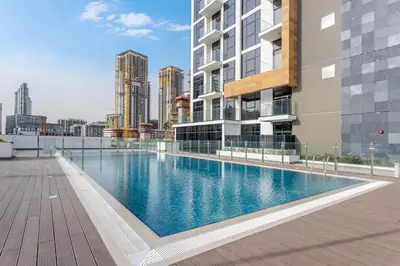 a swimming pool on the roof of a building at Lux-Furnished Stu Couple-Friendly Near Downtown in Dubai