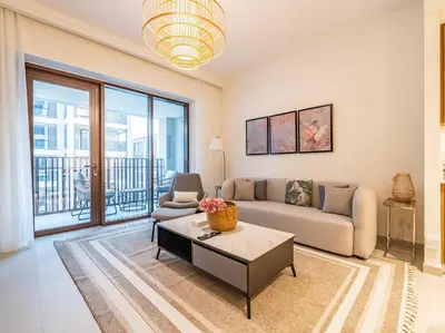 a living room with a couch and a table at Ravishing Retreat 2BR Creek Beach Luxury Abode in Dubai