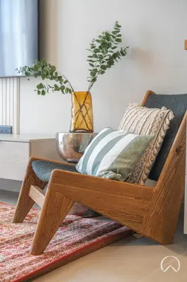 a wooden coffee table with pillows and a plant at Oraya - Collective 2 0 Tower A Sanctuary in Dubai Hills in Dubai