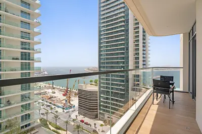 a balcony with a grand piano on a building at Silkhaus Sea & Palm View 1BDR in Marina Vista in Dubai