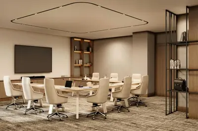 a conference room with a table and chairs and a screen at Marriott Hotel Production City, Dubai in Dubai