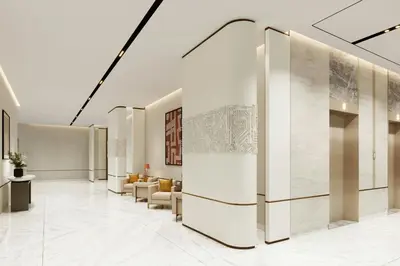 a lobby with a waiting area with couches and chairs at Marriott Hotel Production City, Dubai in Dubai