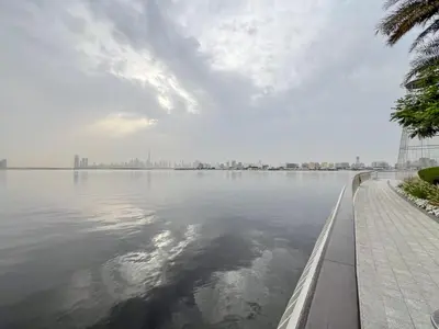 a large body of water with a city in the background at Frank Porter - Bayshore at Creek Beach in Dubai