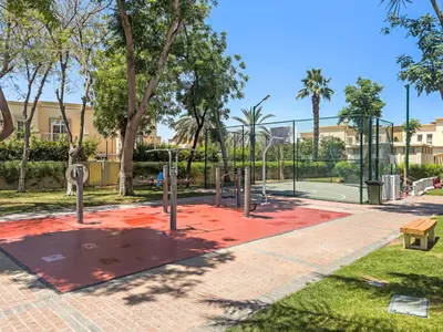 a park with a basketball hoop and a tennis court at Whole 3 BR with Maids Room House - The Springs - Privat Garden in Dubai