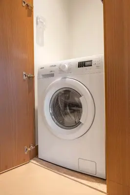 a white washing machine sitting in a room at Address Dubai Opera Residences in Dubai