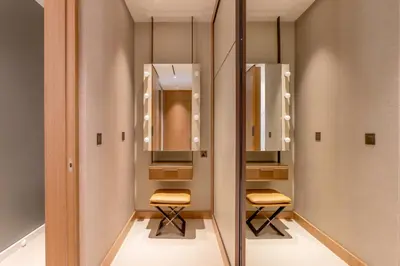 a dressing room with two stools and mirrors at Address Dubai Opera Residences in Dubai