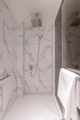 a bathroom with a shower with a glass door at Address Dubai Opera Residences in Dubai