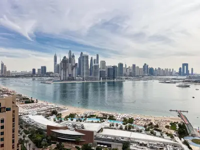 a view of a city with a body of water at The Smart Concierge - Seven Palm in Dubai