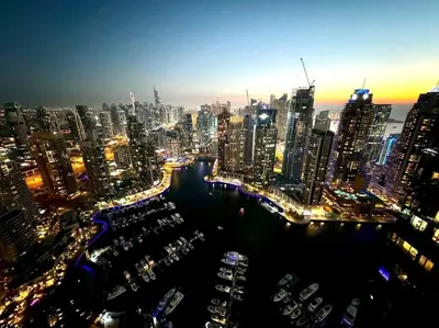 a view of a large city at night at Dubai Marina Gate 1 Deluxe in Dubai