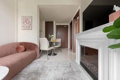 a living room with a couch and a fireplace at Glamorous 1Bedroom in Business bay l Large Balcony in Dubai