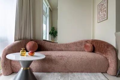 a living room with a couch and a table at Glamorous 1Bedroom in Business bay l Large Balcony in Dubai