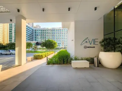 a building with a sign on the side of it at Luxe 1BD apartment in La Vie with beach access in Dubai