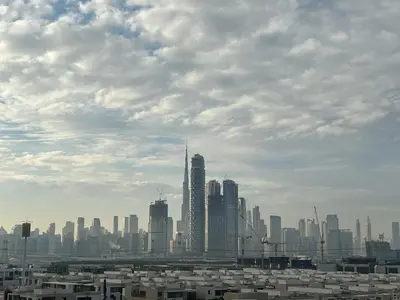 a city skyline with tall buildings in the foreground at Modern studio view Burj Khalifa in Dubai