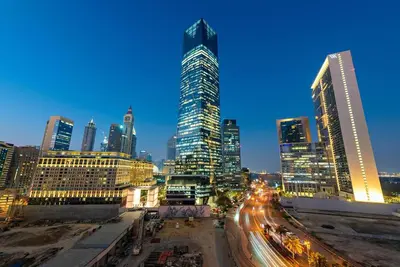 a city skyline at night with traffic in the street at First Class 1BR Modern & Stylish Living in Dubai