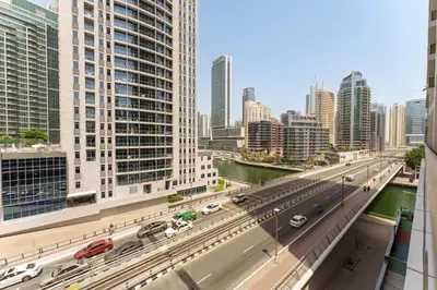 a view of a city with a highway and buildings at Elevated Living studio in Sparkle Tower- Suiteable in Dubai