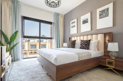 a bedroom with a large bed and a large window at Frank Porter - Eleganz 5 in Dubai