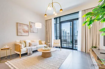 a living room with a couch and a table at Charming 1BR Apartment in Creek Edge Tower 1, Dubai Creek Harbor by Deluxe Holiday Homes in Dubai