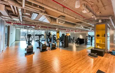 a gym with treadmills and ellipticals in a building at Apartment in Downtown Dubai (Burj Khalifa Views) in Dubai