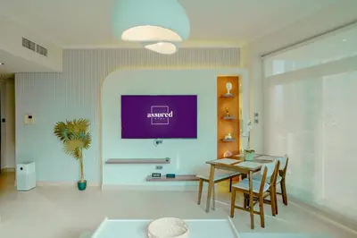 a dining room with a table and chairs at Brand New 2BHK Luxury Apartment 7min to Dubai Mall 1.5 Bath in Dubai