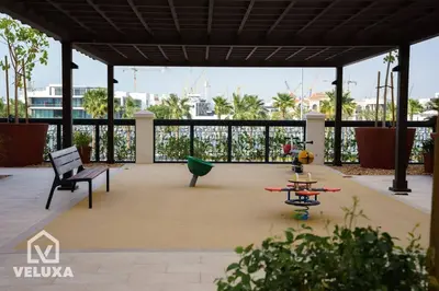 a patio with a bench and a table on a roof at Veluxa - Stunning Sea View - Luxe 3 Bed in La Mer in Dubai