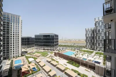 an aerial view of a city with tall buildings at New Cozy 1BR Dubai Hills in Dubai