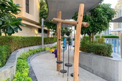 a playground in a building with a swing at Frank Porter - Opera Grand in Dubai