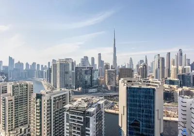 an aerial view of a city with tall buildings at Upgraded Studio in Business Bay in Dubai