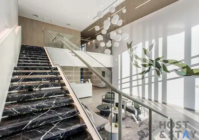 a staircase in a building with a glass floor at Comfy 1BR at JVC - Ideal for Family & friends in Dubai