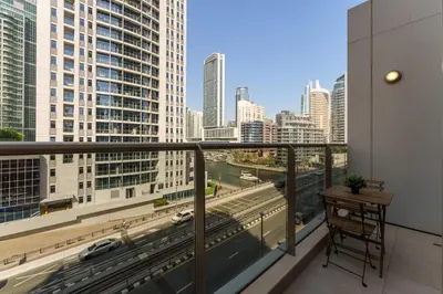 a balcony with a view of a city skyline at Elegant studio in Sparkle Tower by Suiteable in Dubai