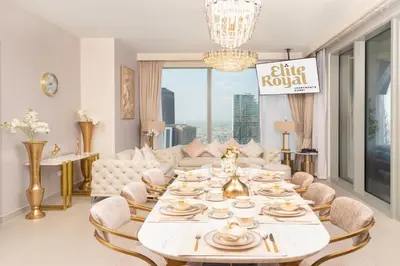 a living room with a table and a couch at Elite Royal Apartment - Panoramic with Burj Khalifa & Full Fountain View - High Floor - Patron in Dubai