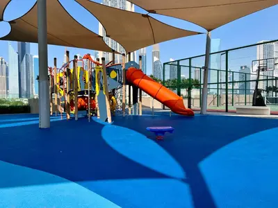 a playground in a building with a slide at Downtown Views 2BR - Dubai Mall, Fountain & Burj Khalifa access in Dubai