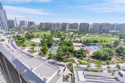 an aerial view of a park in a city with tall buildings at Branded 2BR Residence with Direct Park Access in Dubai