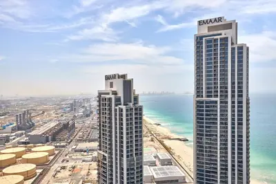 a view of two tall buildings next to the beach at Beachfront 1BR Retreat at Address JBR in Dubai
