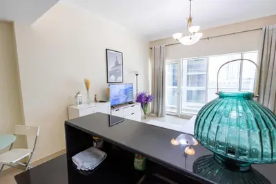 an office with a desk with a large glass vase at Dubai Downtown Dubai Mall & Burj Khalifa DIFC 5 mins in Dubai