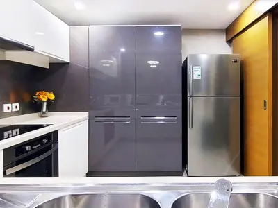 a kitchen with a large stainless steel refrigerator at Claren Tower 2 - Downtown by Golden Casa in Dubai