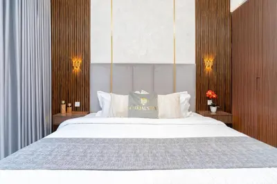 a bedroom with a large white bed with white pillows at GLOBALSTAY Creek Edge Tower Elegant Apartments in Dubai