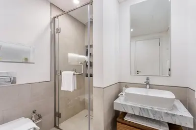 a bathroom with a sink and a shower at One Bedroom Apartment in Madinat Jumeirah Living by The S Holiday Homes in Dubai