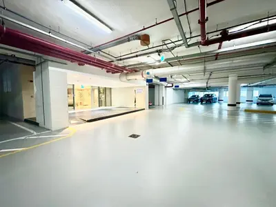 an empty parking lot in an empty parking garage at Wonderful 1BR Apt with Marina view in Dubai