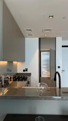 a kitchen with a sink and a counter top at Exclusive Canal Waterfront Views 15 Northside in Dubai