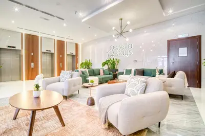 a living room with couches and a table at Stella Stays Lana Tower in Dubai