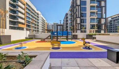a playground in the middle of a city at Frank Porter - Riviera 27 in Dubai