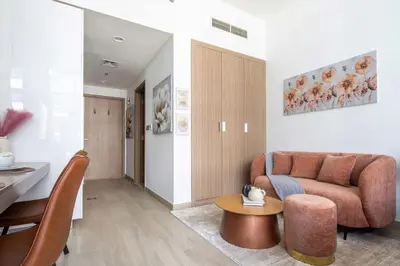 a living room with a couch and a table at Frank Porter - Riviera 27 in Dubai