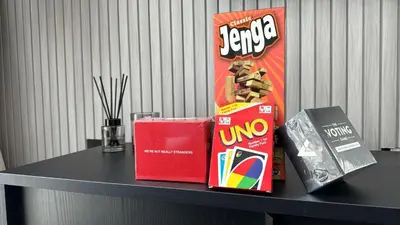a table with a bag of chips and a box of candy at Oraya - Brand New 2BR Apt in Socio Tower at Dubai Hills in Dubai