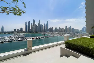 a view of a city skyline from a building at Chic Apartments in Marina Vista Emaar Beachfront in Dubai