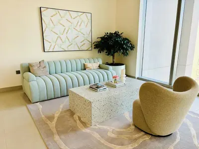 a living room with a couch and a coffee table at Forte Tower - Downtown Dream, Ocean View, Opposite Dubai Mall in Dubai